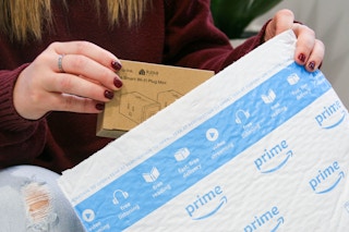 kasa smart plug being pulled out of amazon prime package