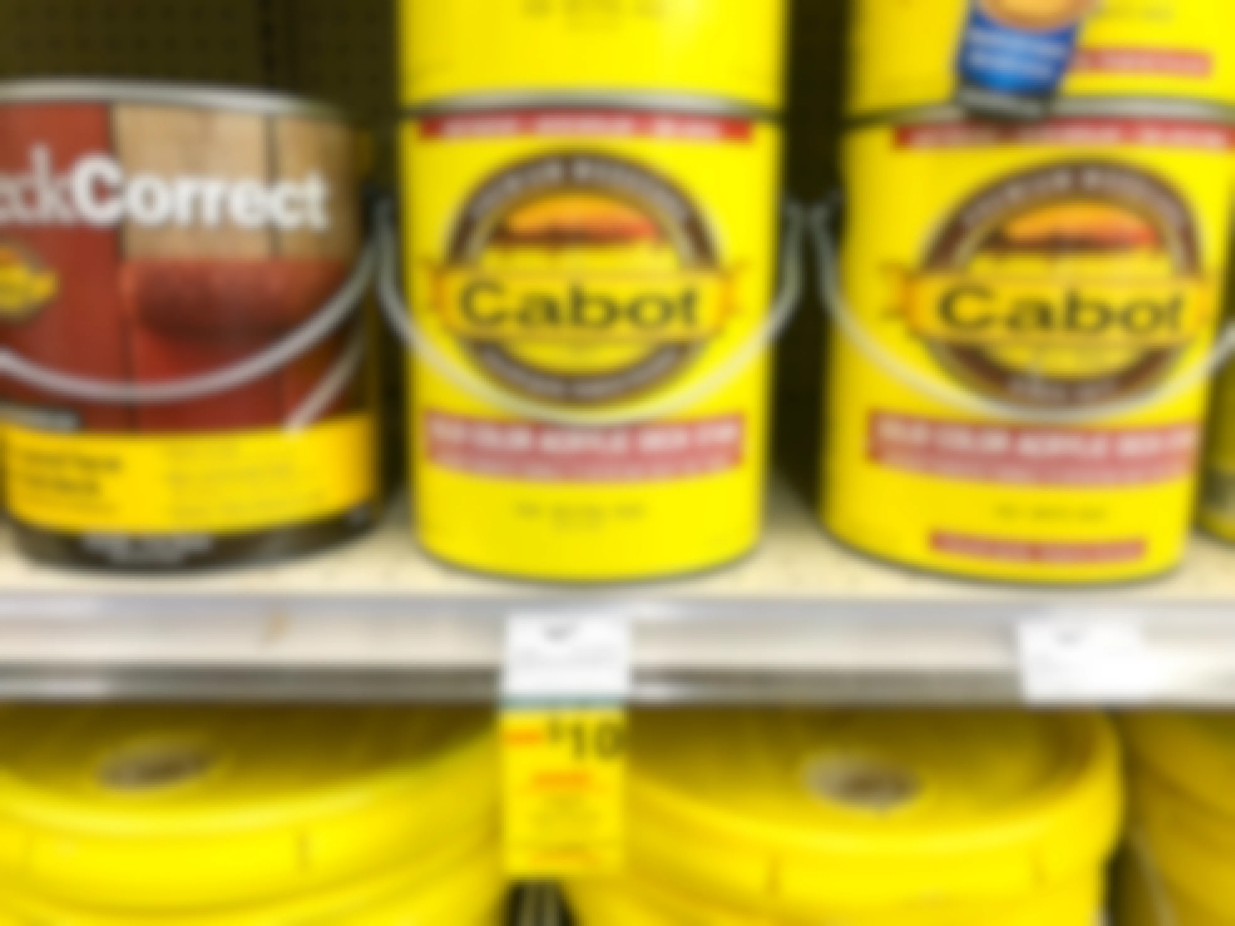 cabot acrylic deck stain gallons on the shelf at ace hardware with a labor day sale sticker