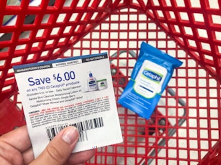 hand holding a cetaphil coupon at target