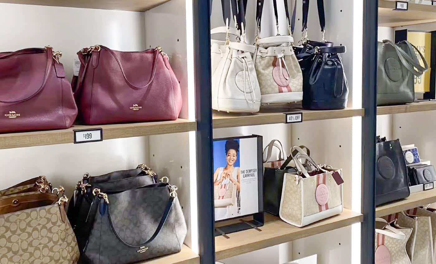Bags on display at a Coach Outlet store.
