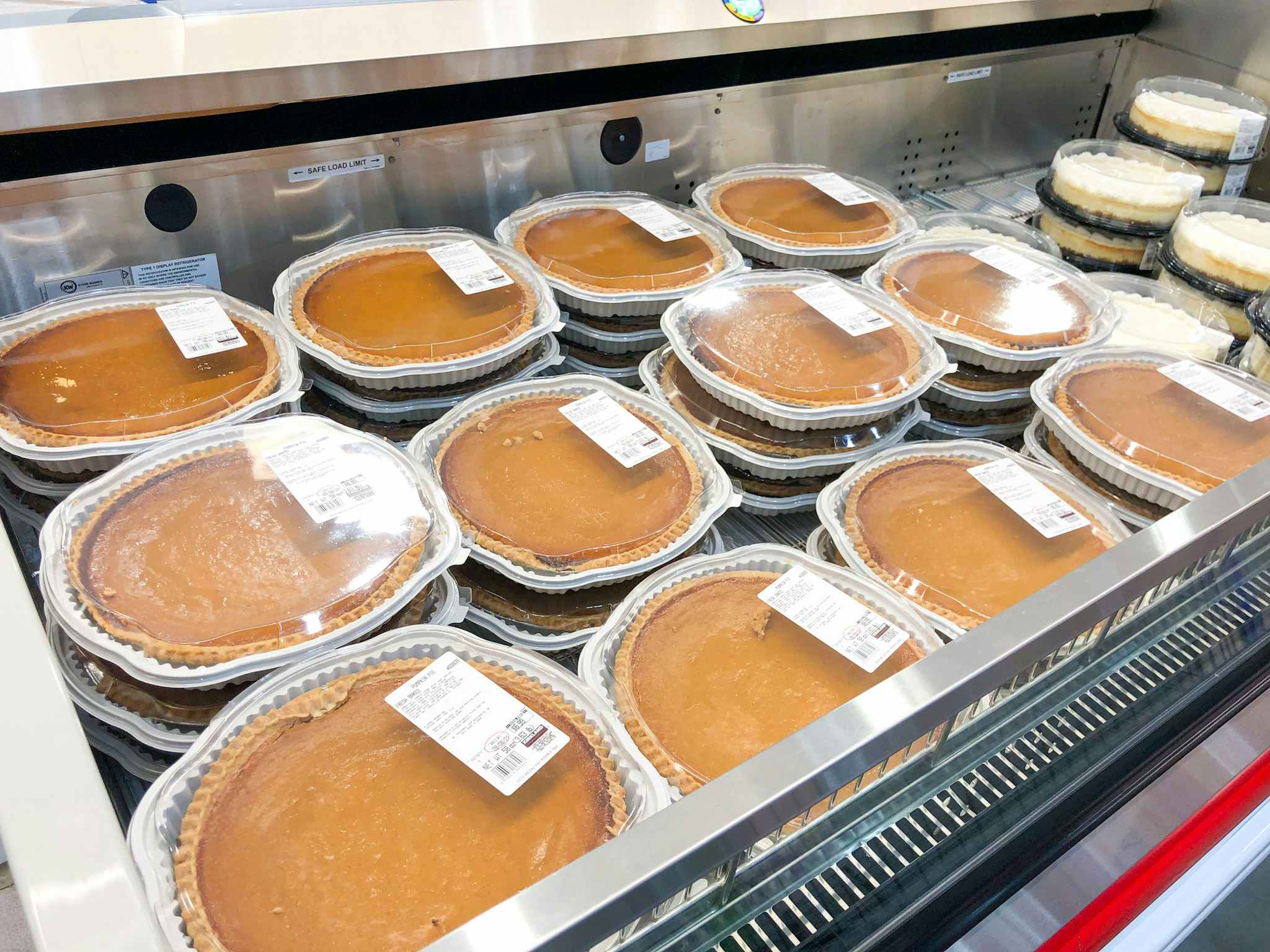 display of pumpkin pies in store cooler