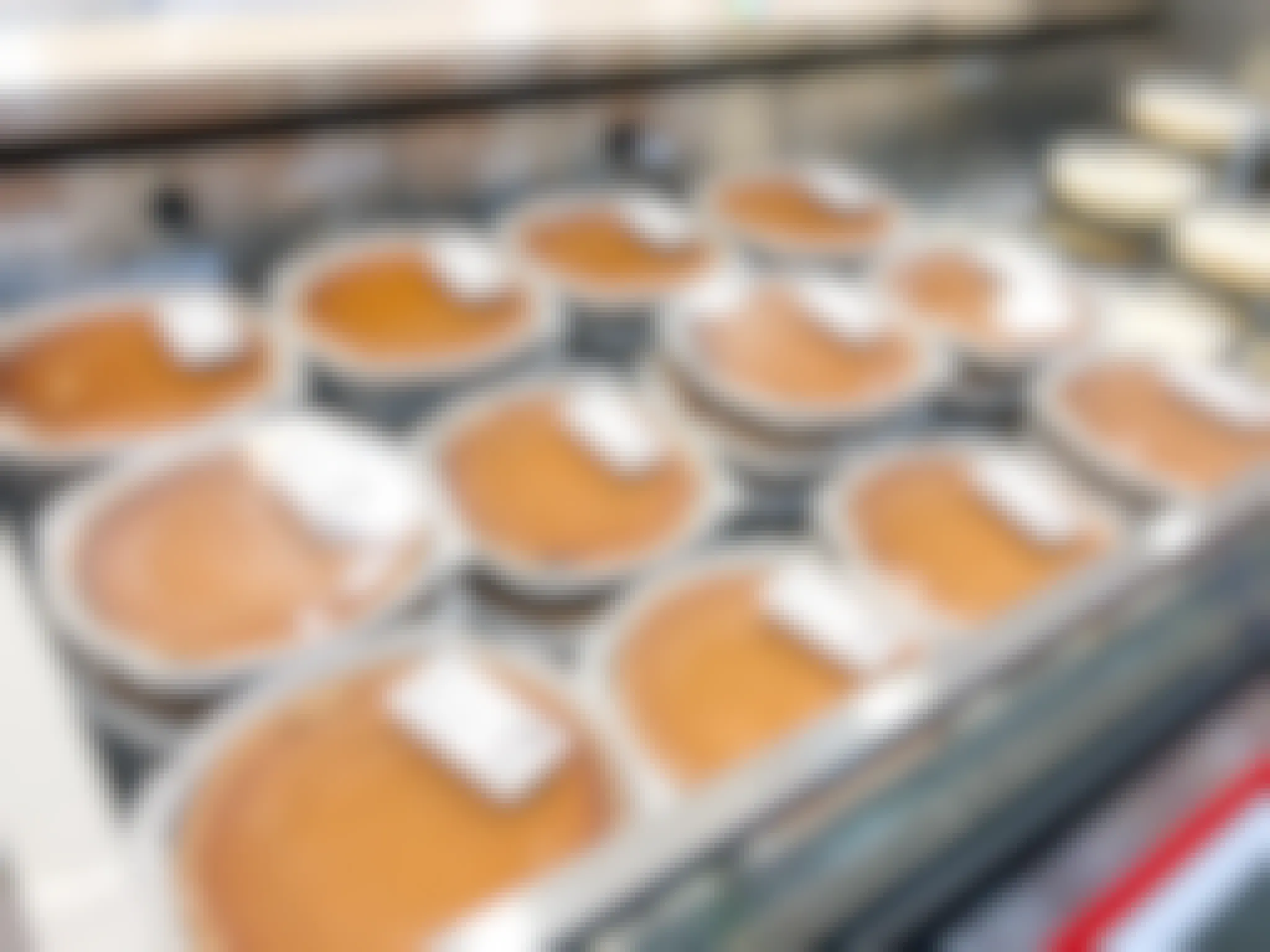 display of pumpkin pies in store cooler