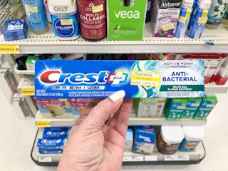 hand holding crest premium toothpaste clearance at target