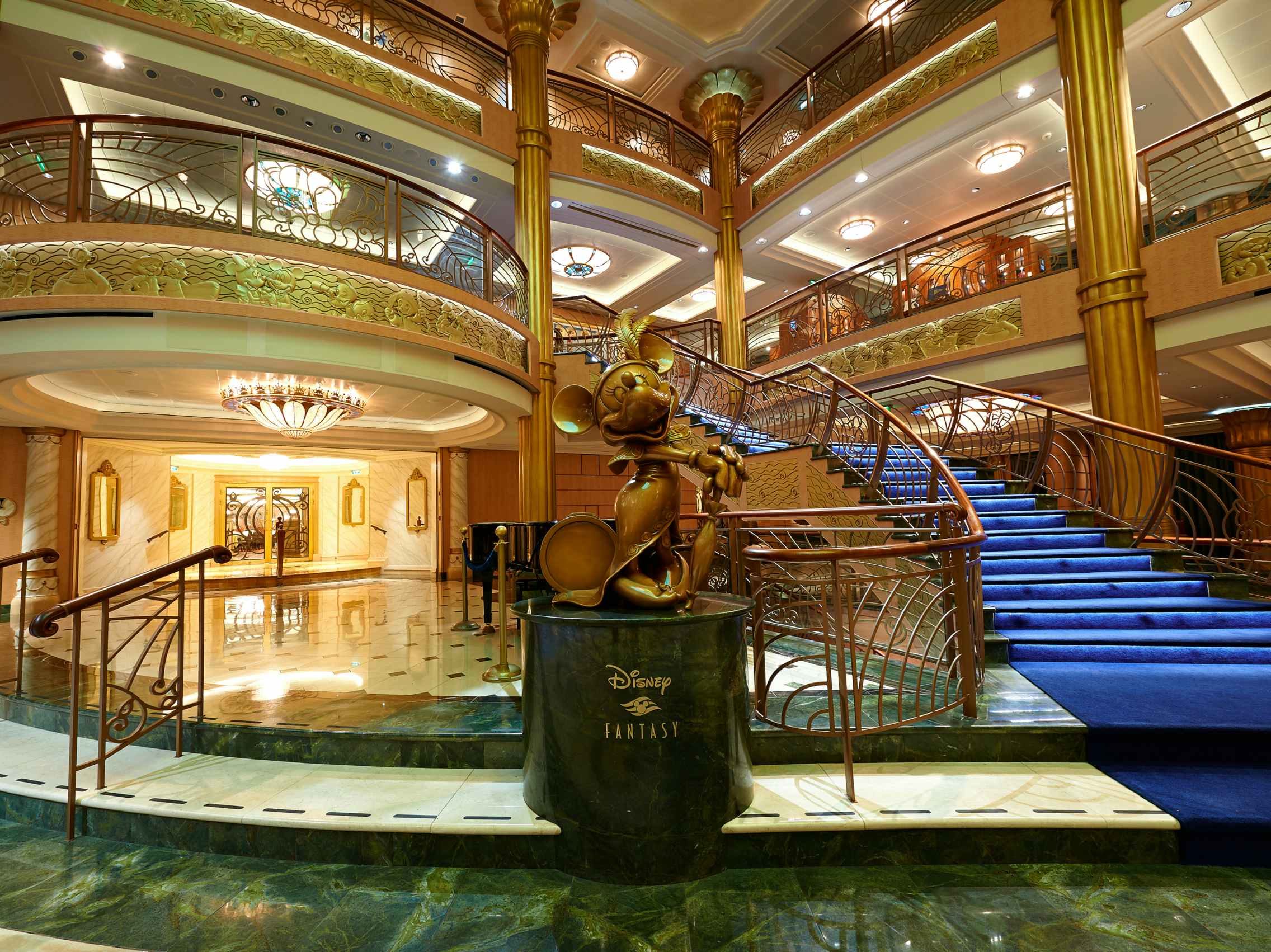 inside the main hall of a disney cruise ship