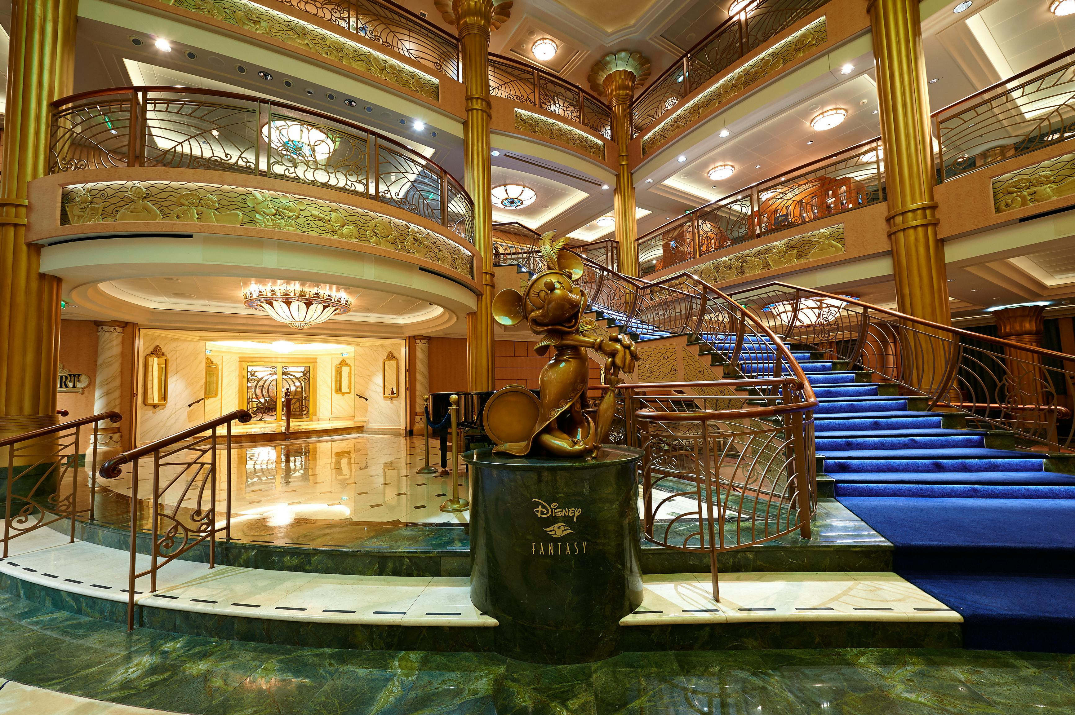 inside the main hall of a disney cruise ship