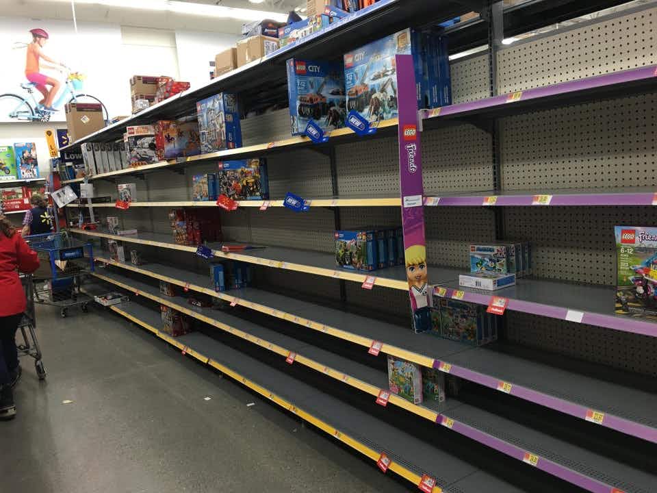 Nearly empty shelves of Lego product at a Walmart store, December 2018