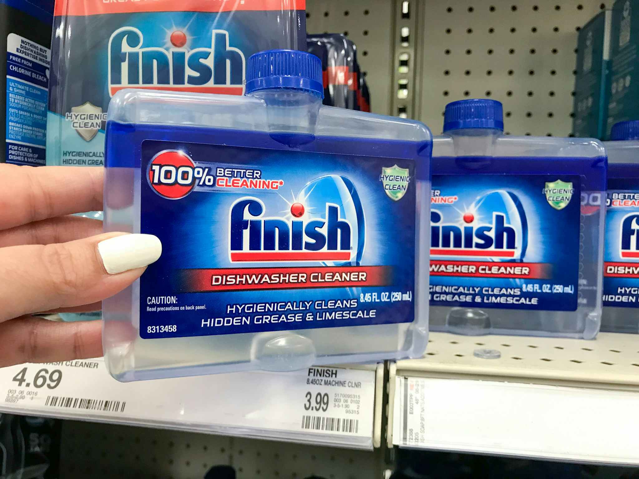 handing grabbing finish dishwasher cleaner off a target shelf