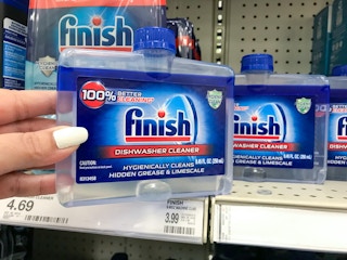 handing grabbing finish dishwasher cleaner off a target shelf
