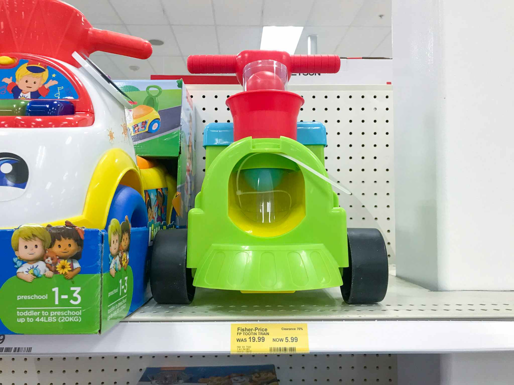 fisher-price train ride-on on a target shelf