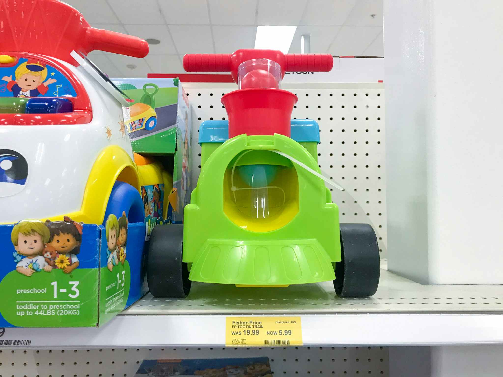 fisher-price train ride-on on a target shelf