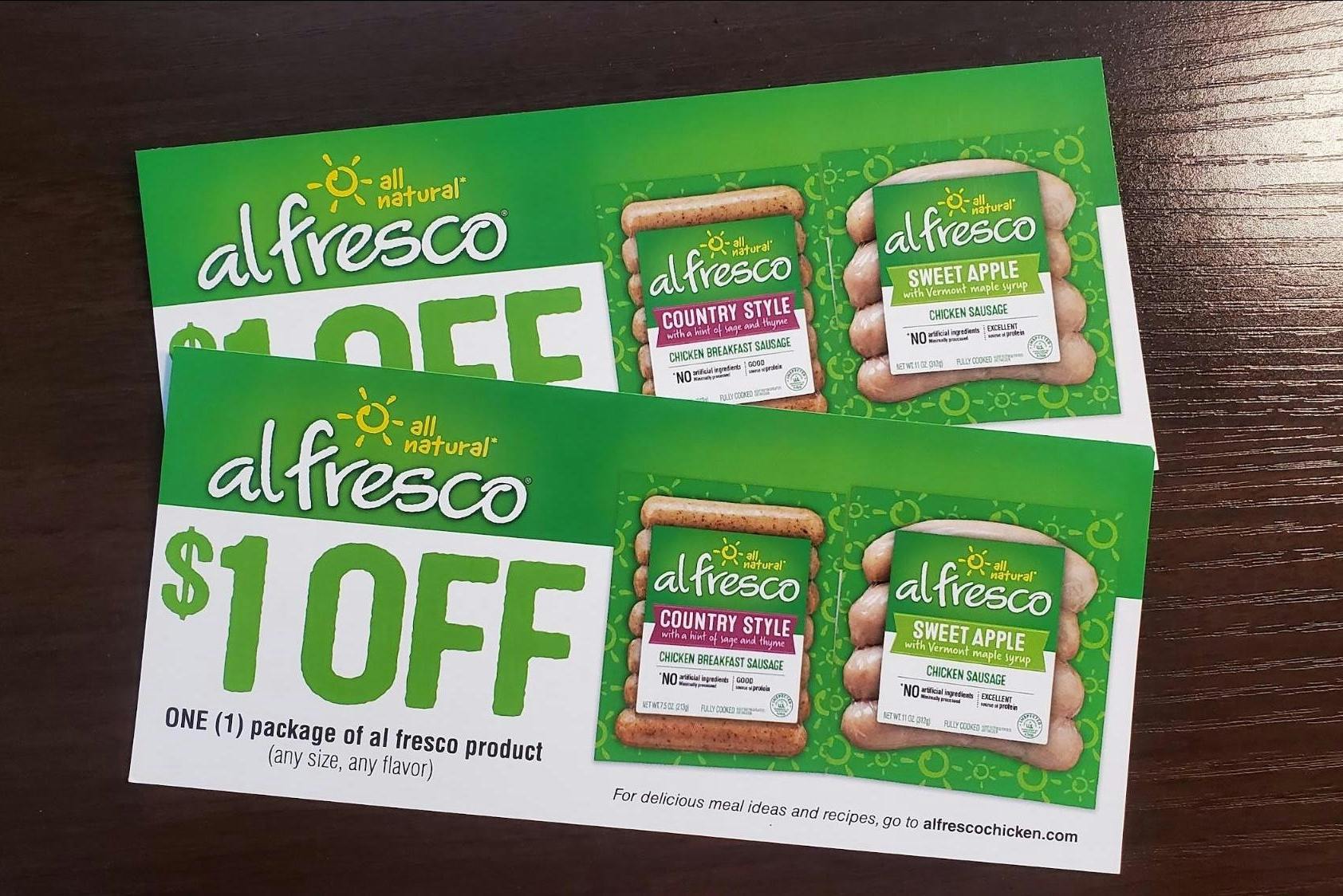 Two $1 off Al Fresco coupons on a table.