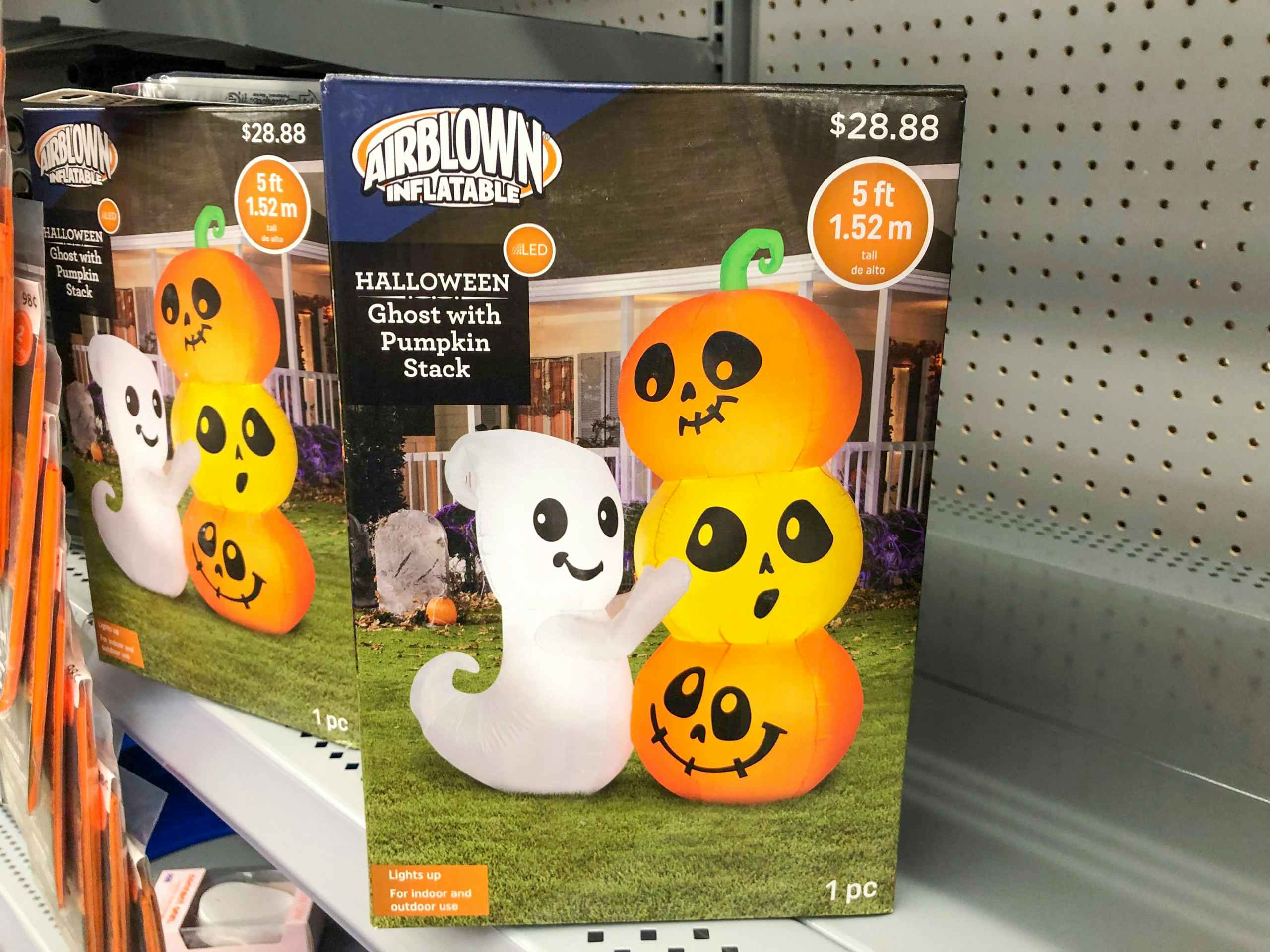 inflatable halloween decor in boxes on Walmart shelf