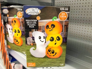 inflatable halloween decor in boxes on Walmart shelf