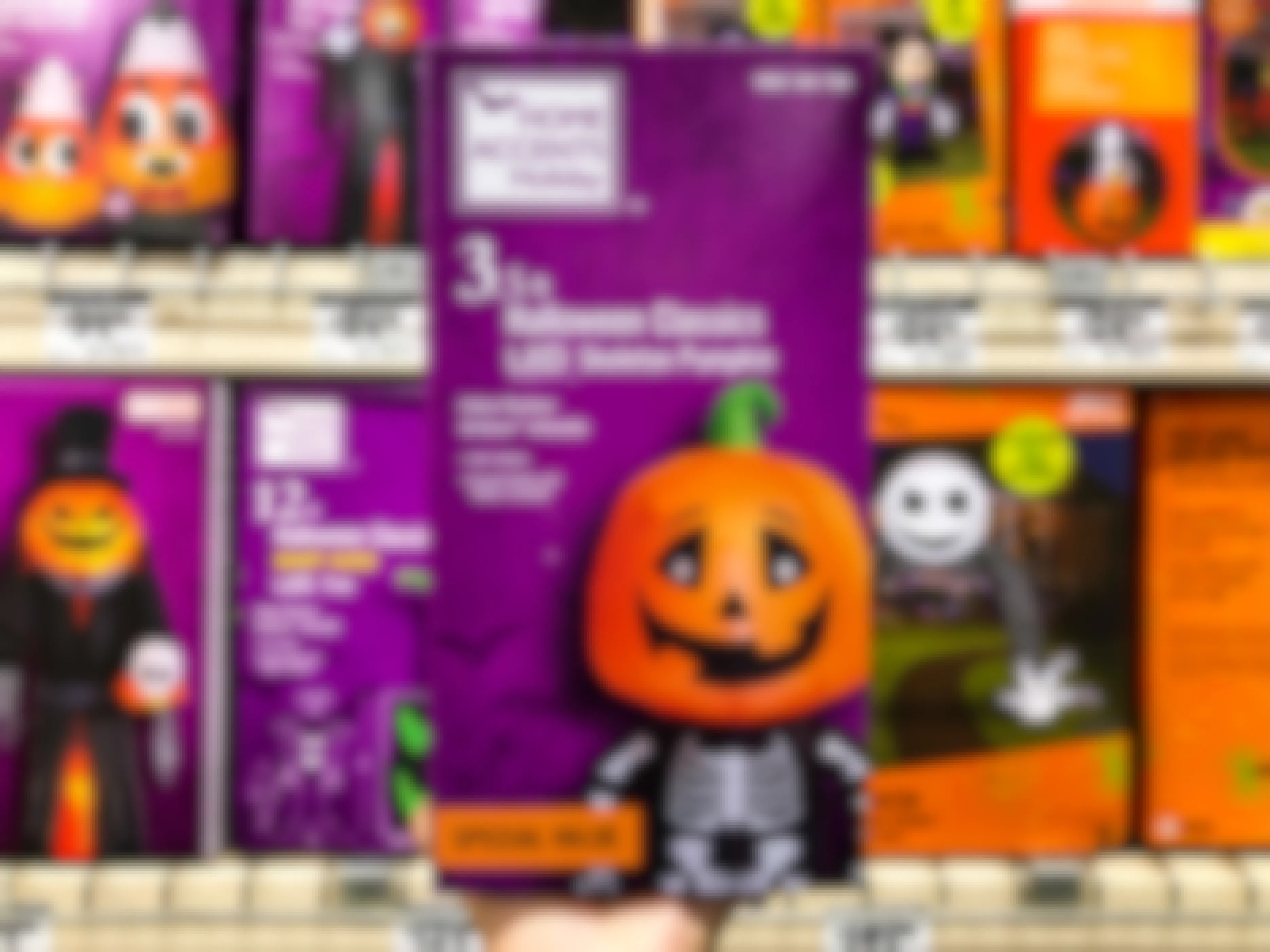 home depot led skeleton pumpkin halloween inflatable being held in front of shelving. 