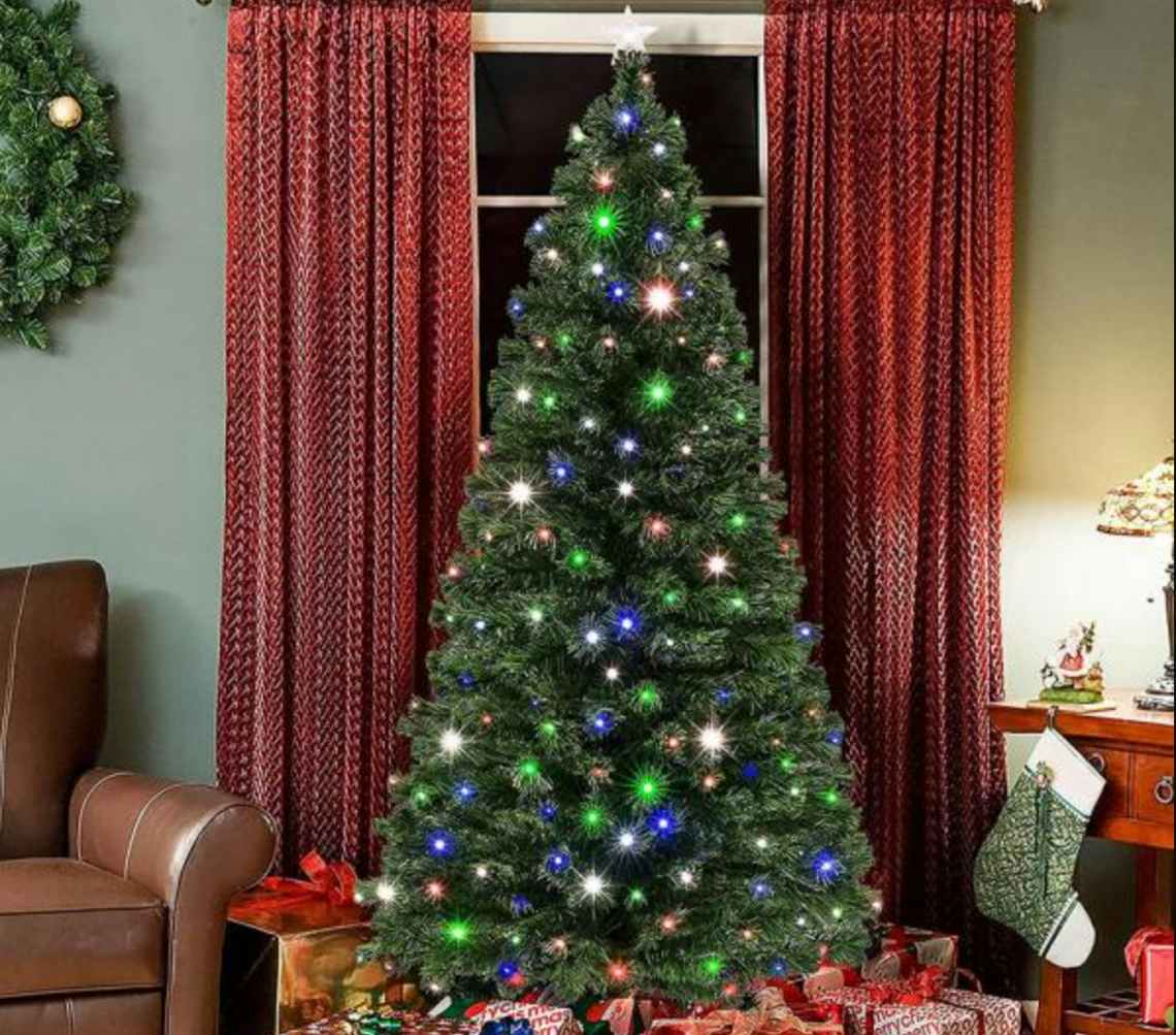 stock photo of veikous pre lit christmas tree staged in living room