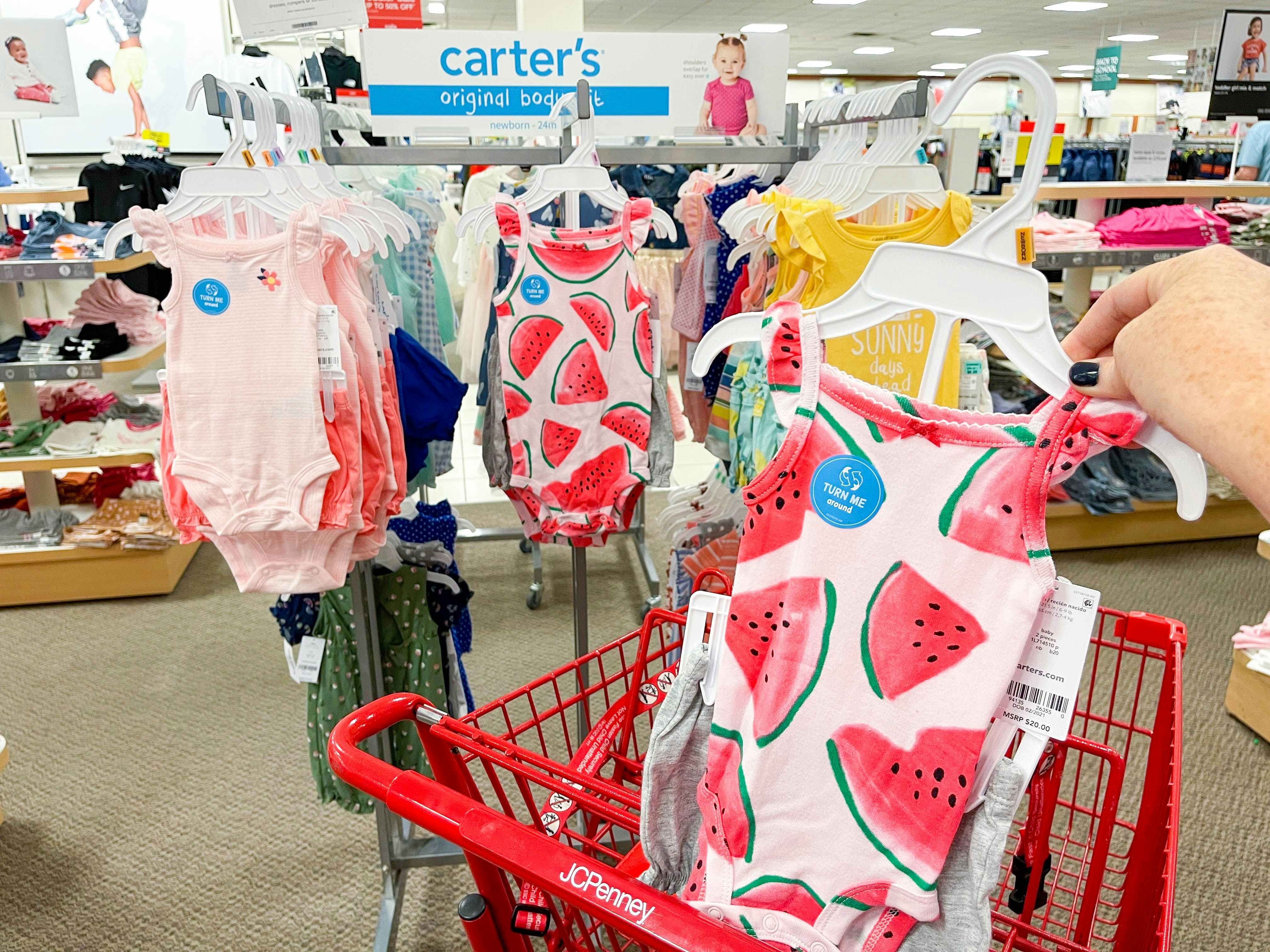 carters baby clothes in cart