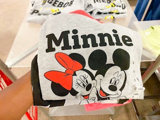 hand holding juniors' disney graphic tee