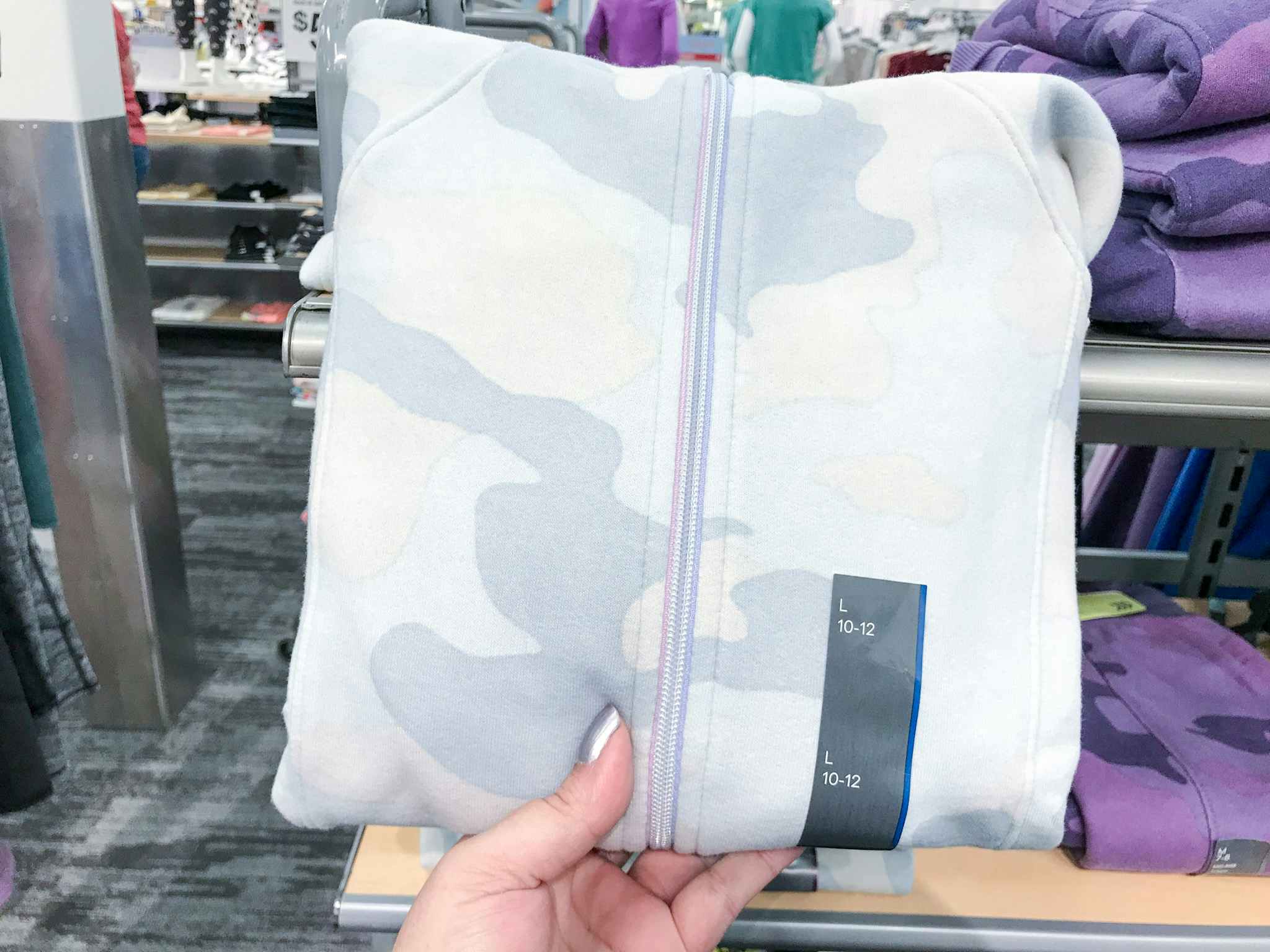 hand grabbing all in motion girls' fleece hooded sweatshirt at target