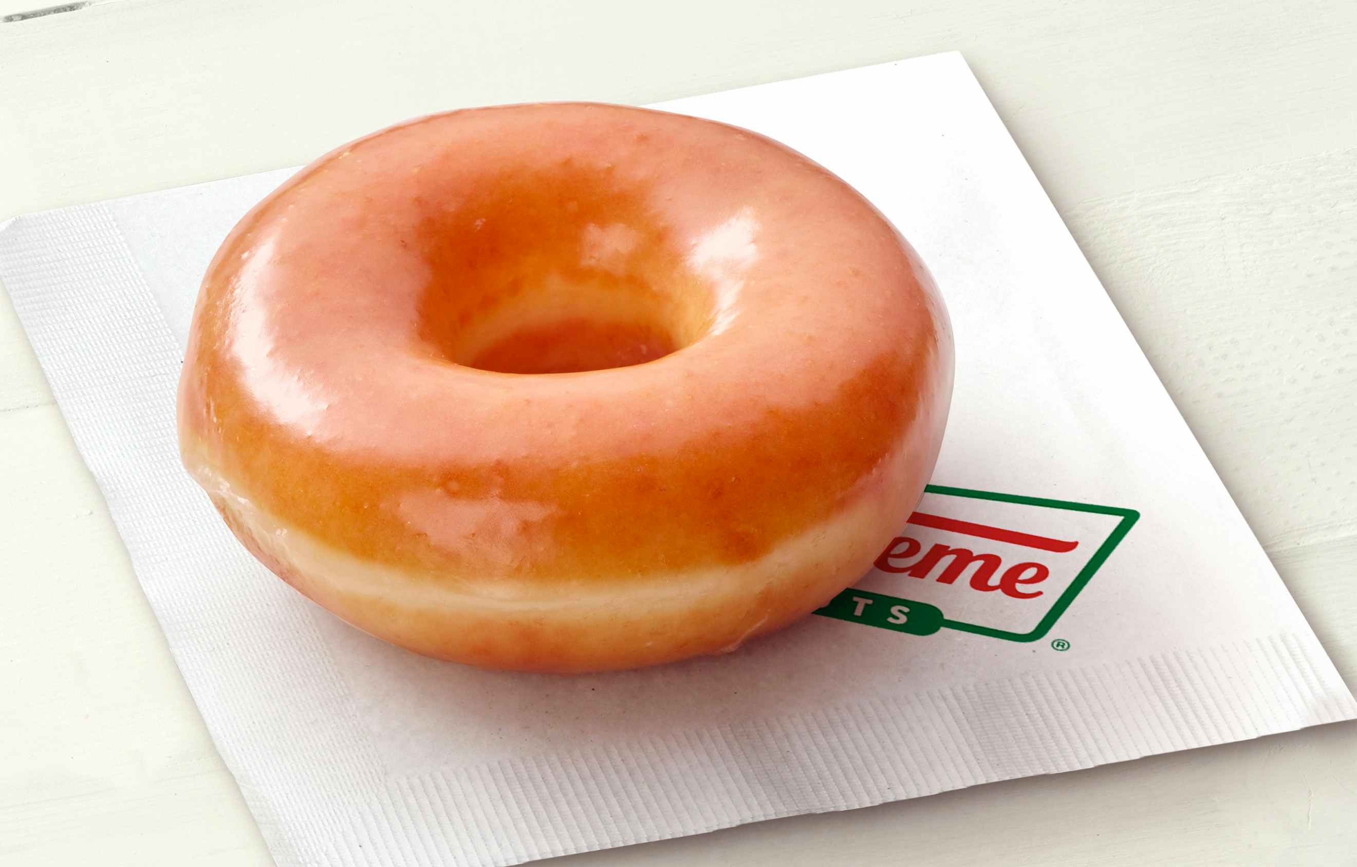Single Krispy Kreme donut on a napkin