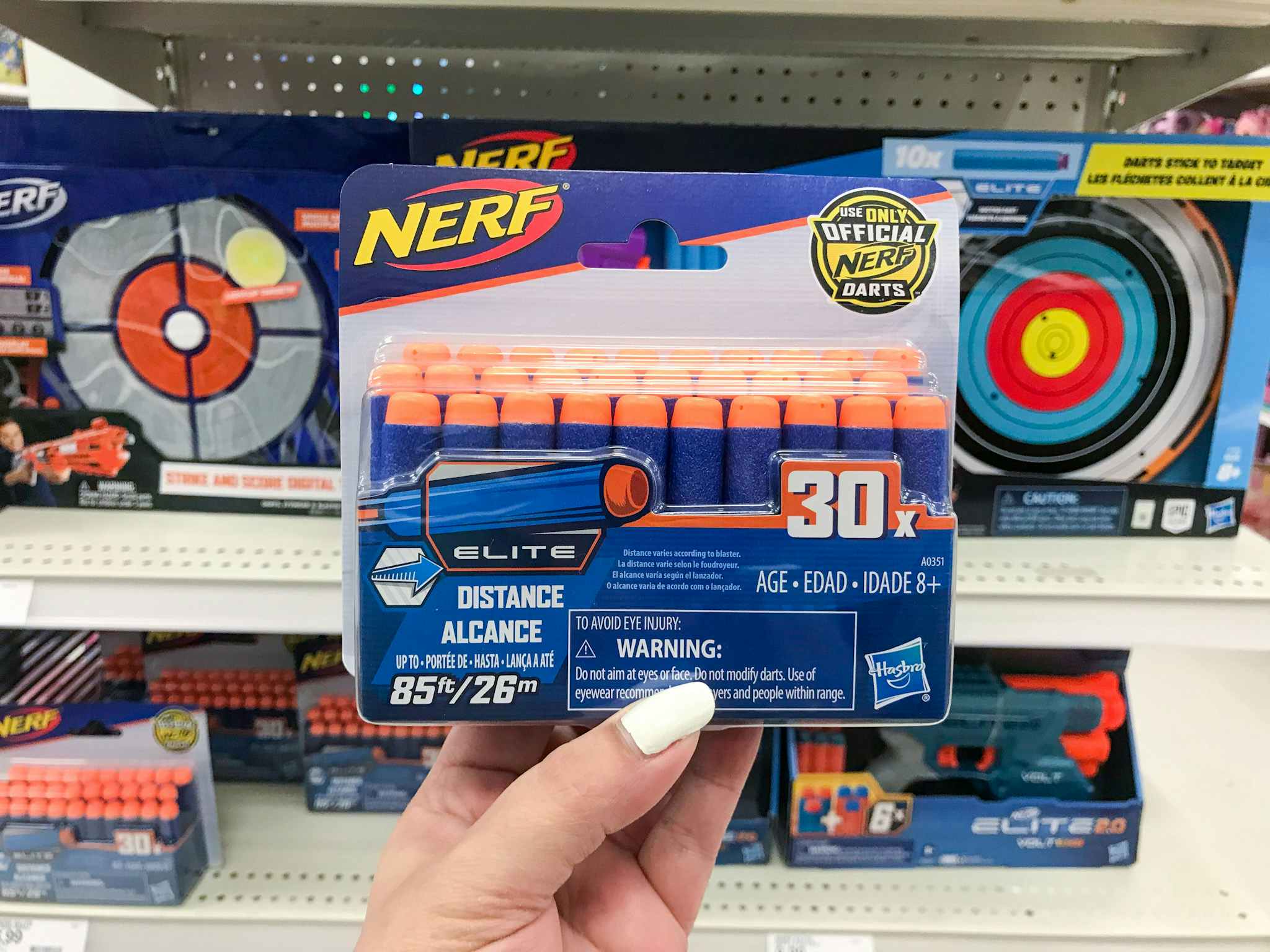 hand holding a nerf elite 30-dart refill at target
