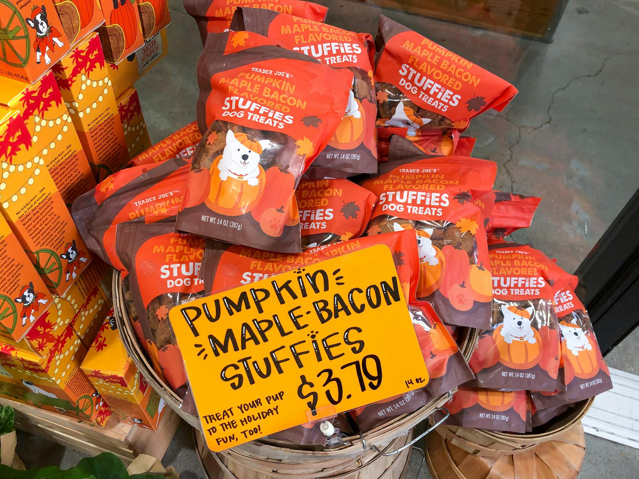Trader Joe's pumpkin maple bacon stuffies for dogs in a basket in store.