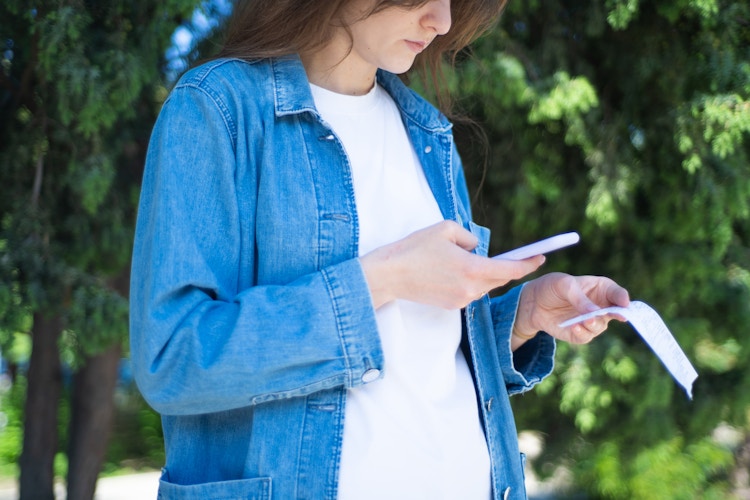 woman scanning receipt