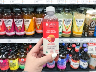 hand holding suja sparkling juice at target