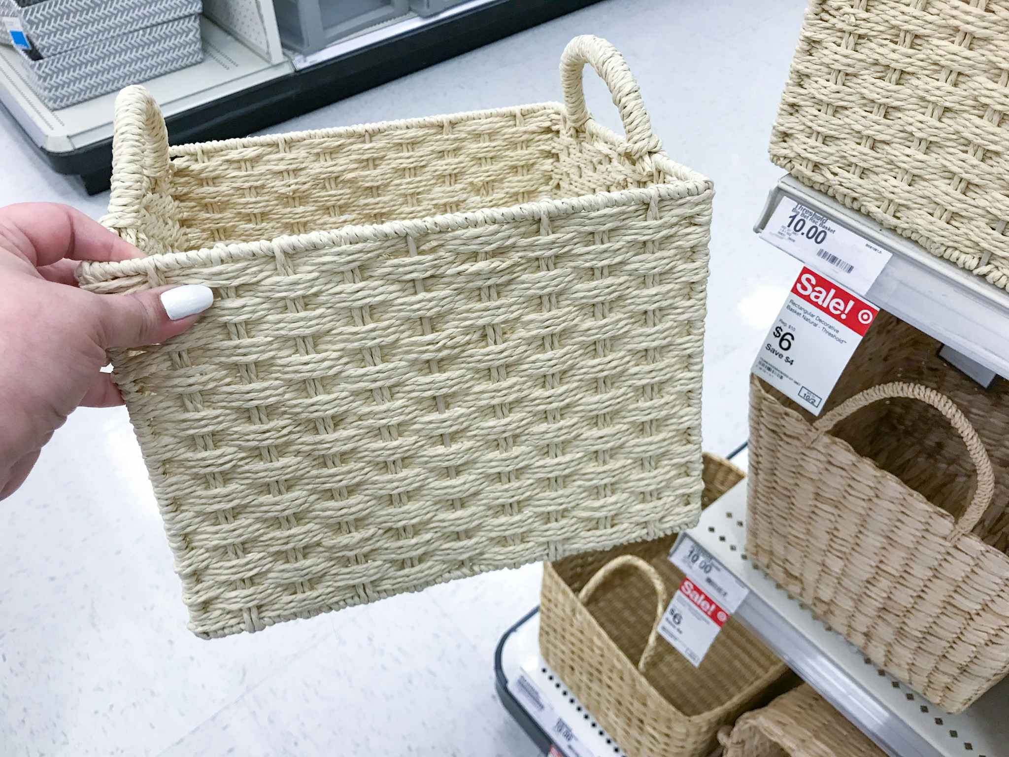 hand holding a threshold storage basket at target