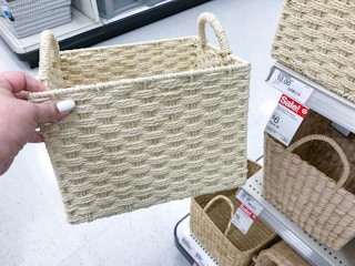 hand holding a threshold storage basket at target