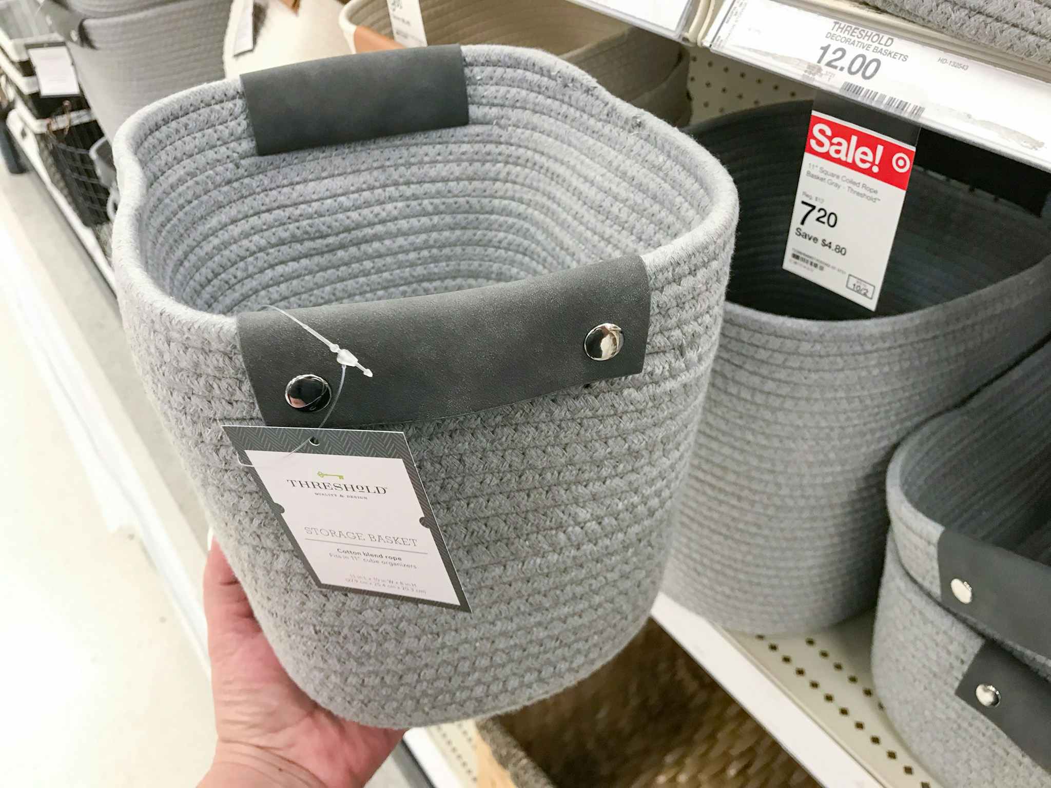 hand holding a threshold storage basket at target