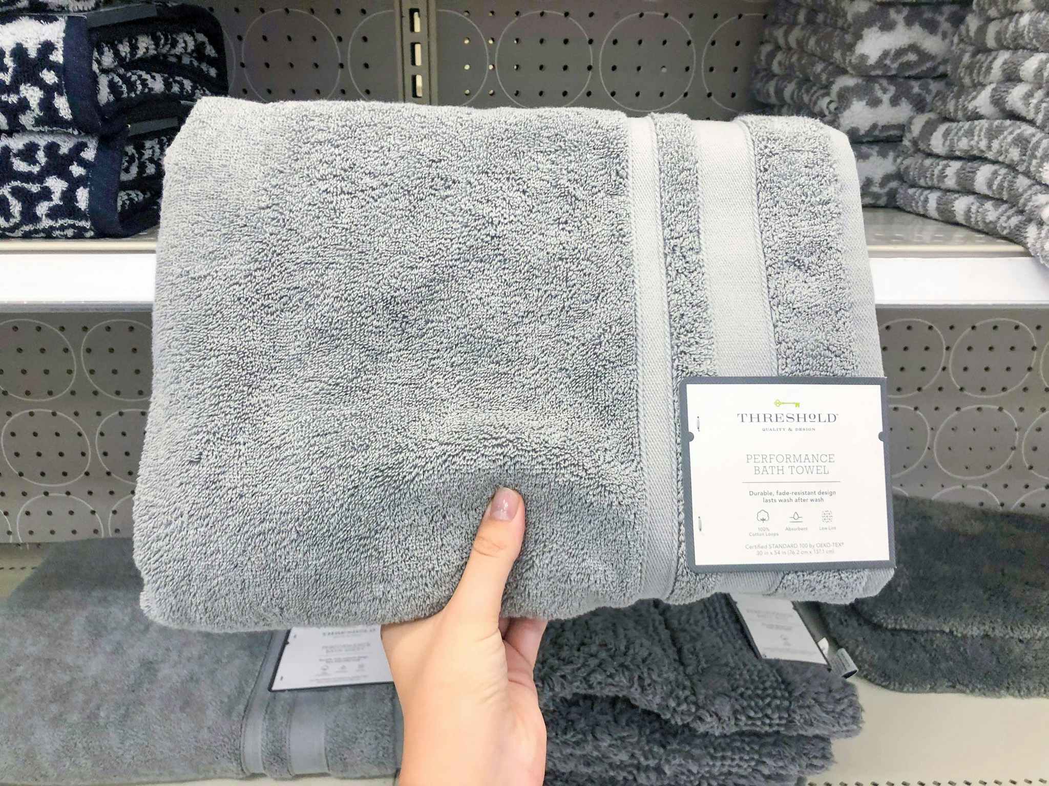 hand holding a threshold bath towel at target