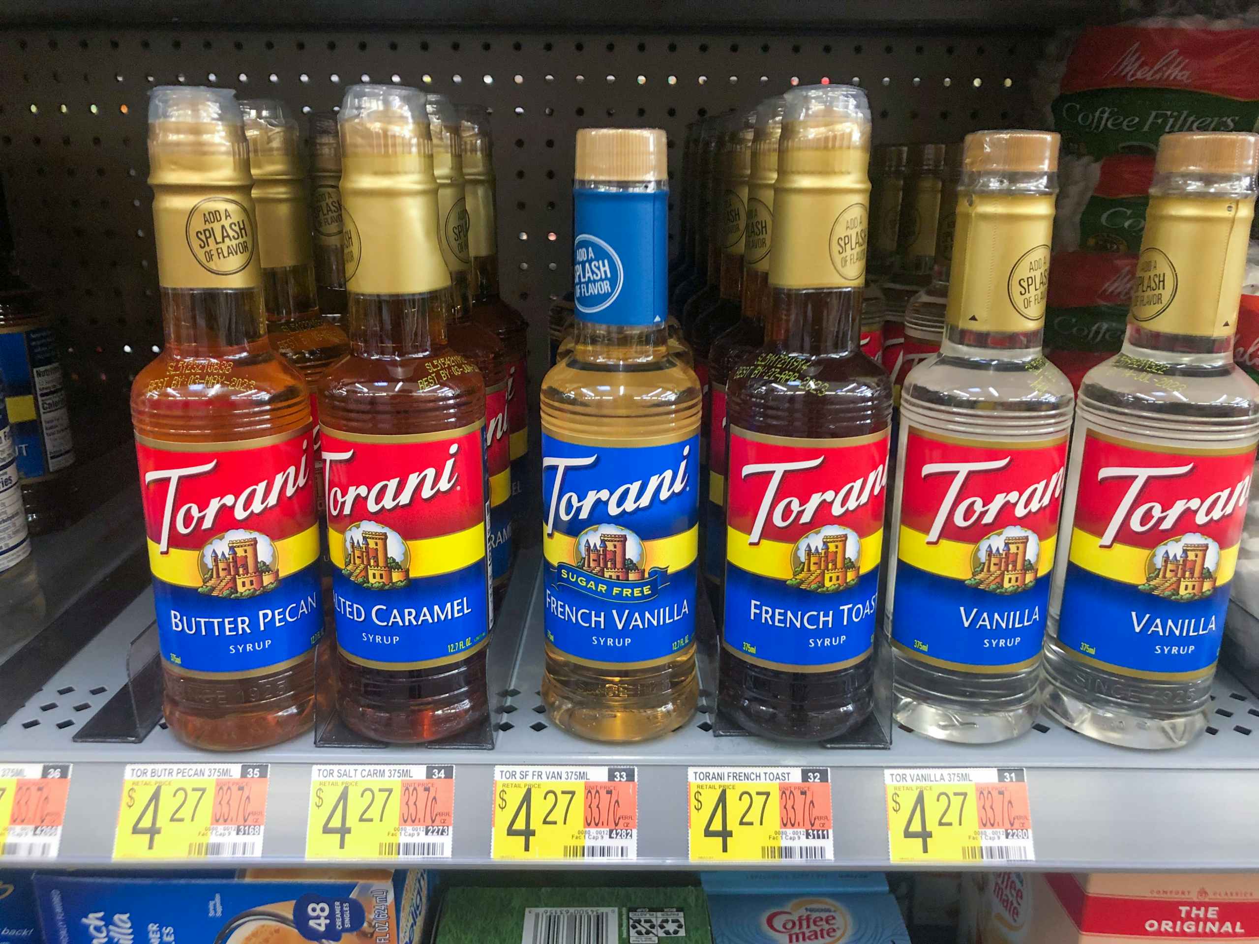 Torani bottles on Walmart store shelf