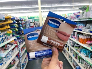 hand holding vaseline lip therapy at dollar tree