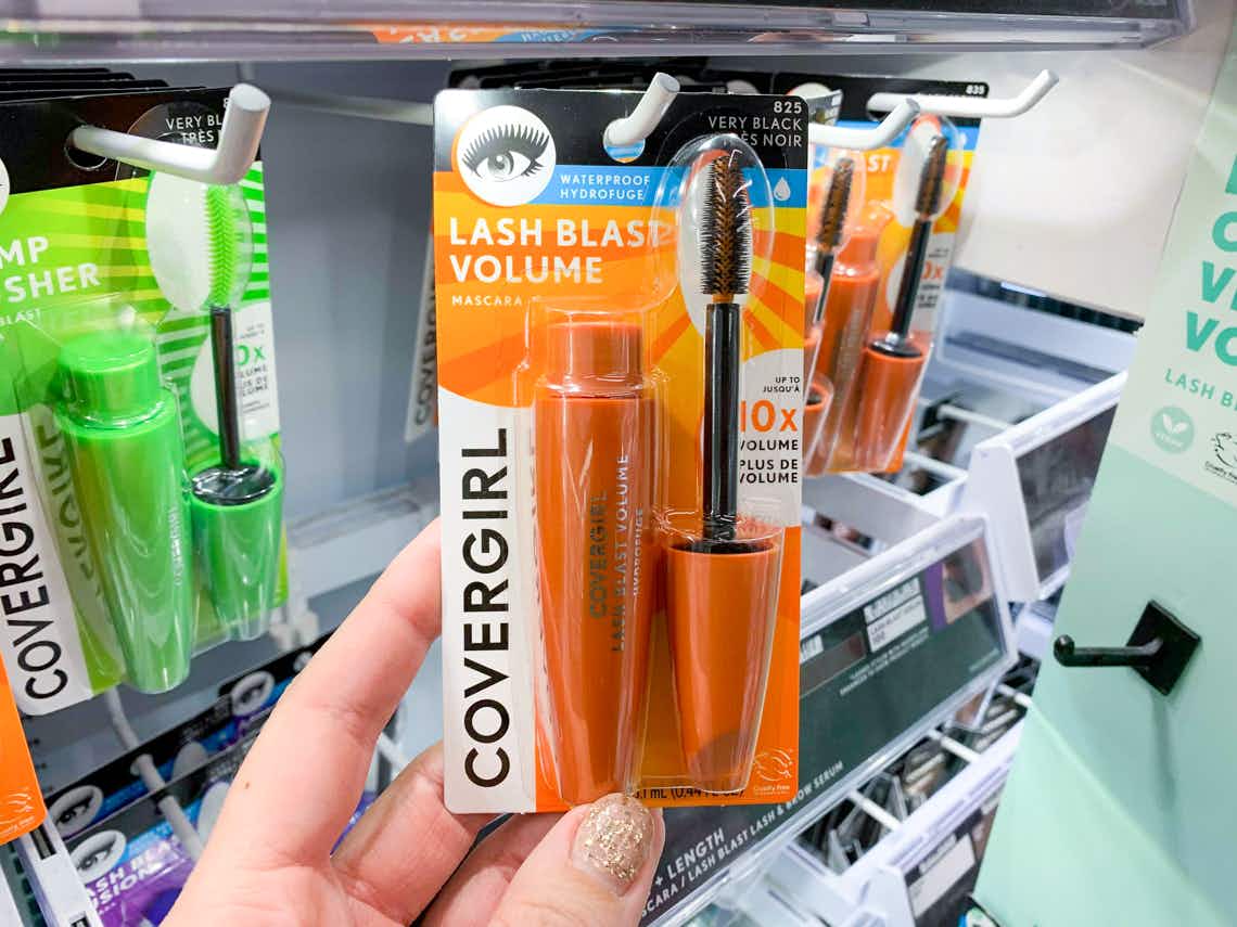 covergirl lash blast volume mascara held in front of other makeup