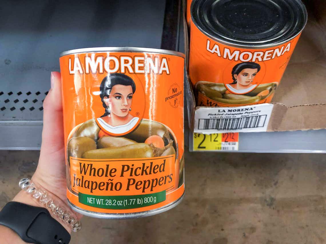 hand holding can of whole pickled la morena peppers