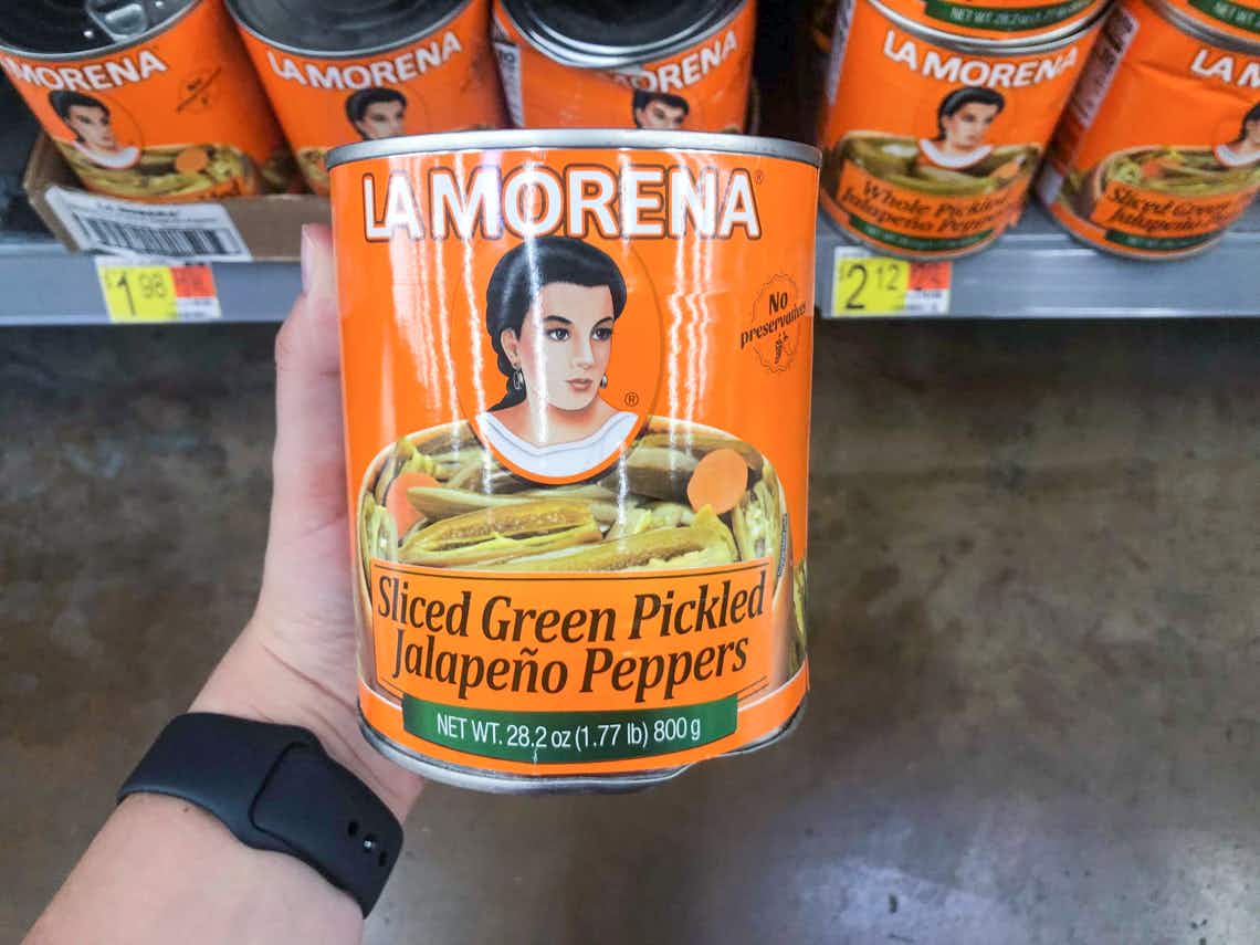 hand holding can of la morena sliced peppers 