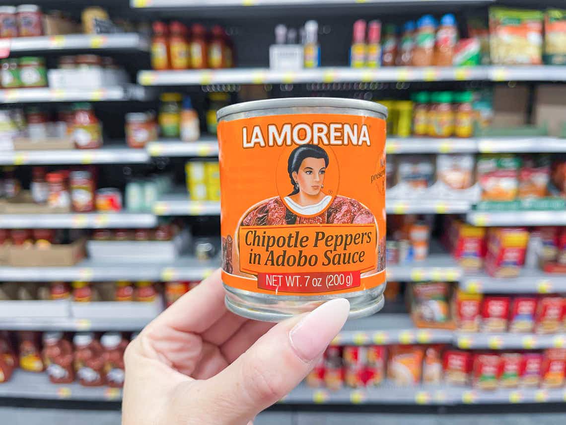 hand holding can of la morena chipotle peppers in adobo 