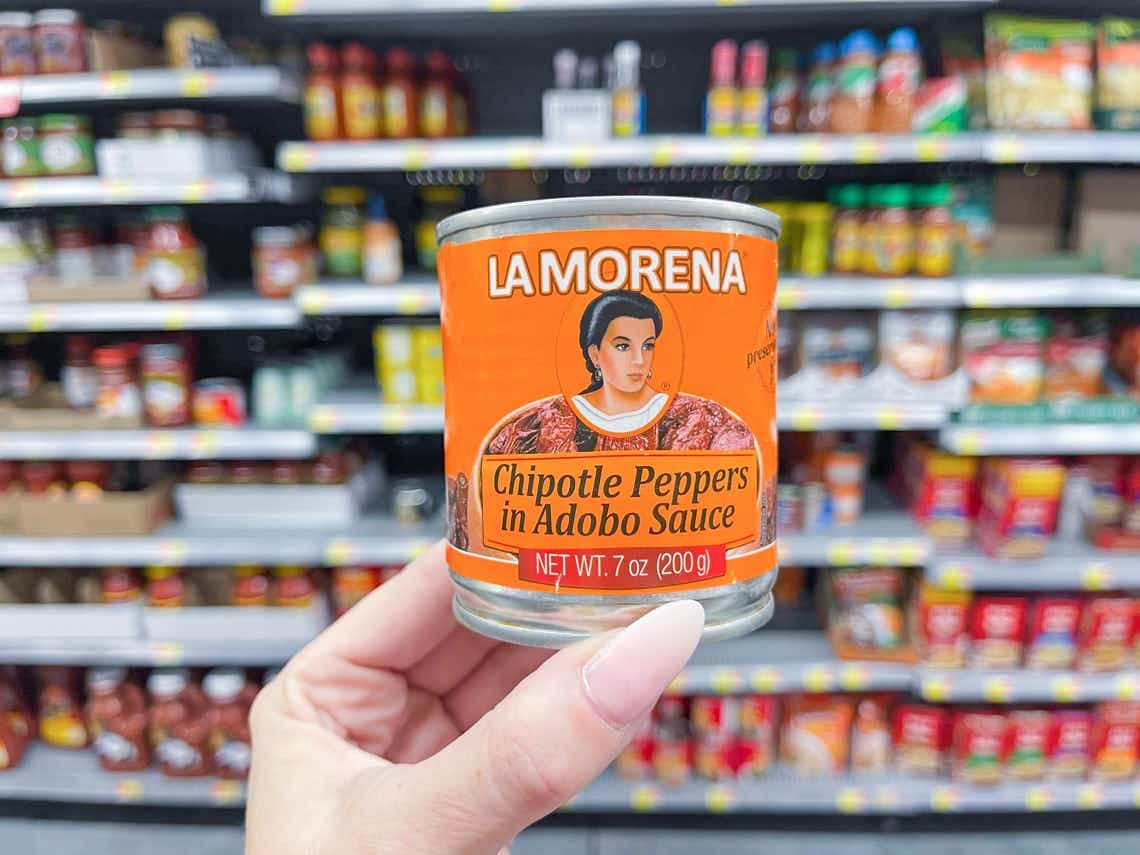 hand holding can of la morena chipotle peppers in adobo