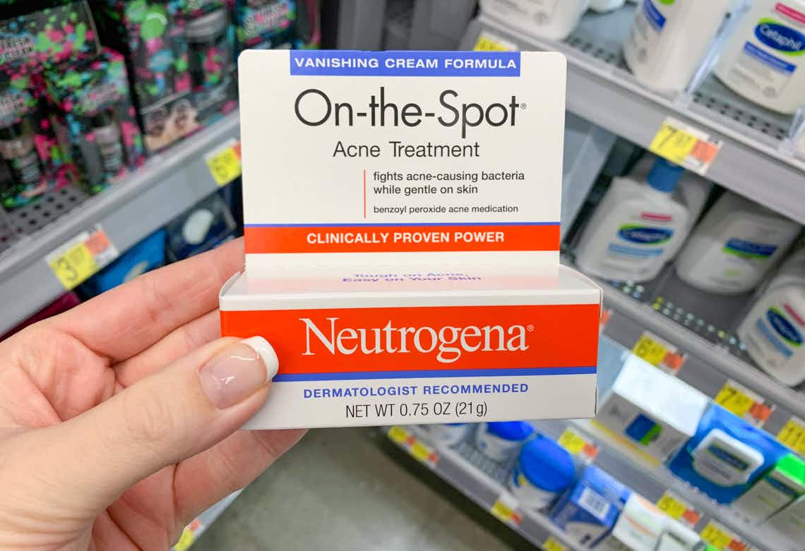 neutrogena on the spot acne treatment held in corner of store aisle