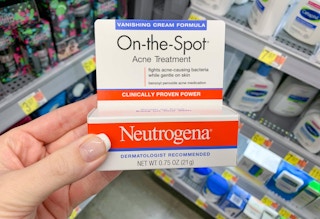 neutrogena on the spot acne treatment held in corner of store aisle