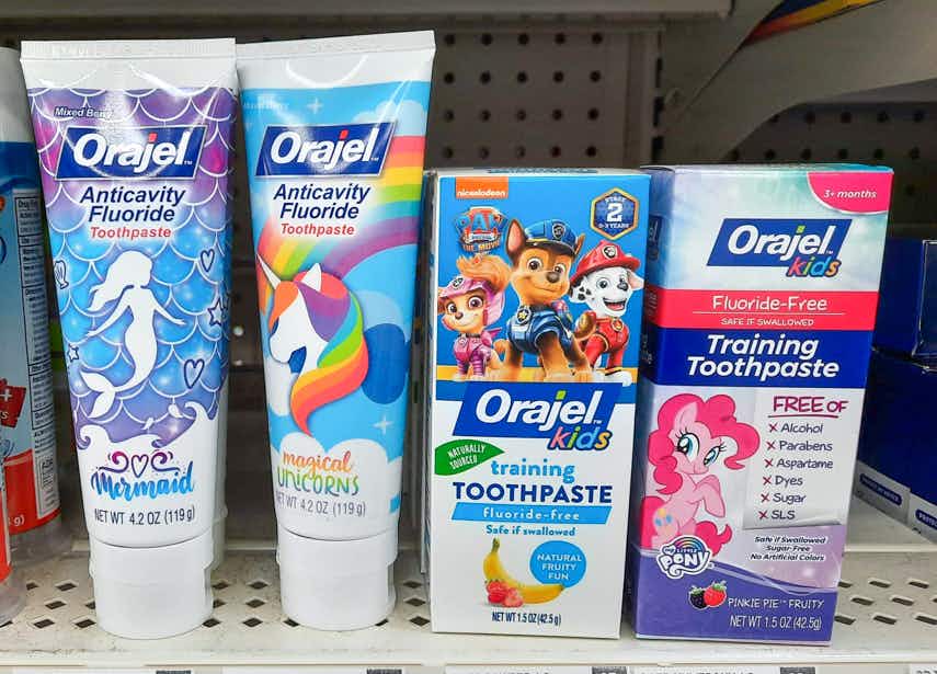 close up of orajel kids toothpaste on walmart shelf