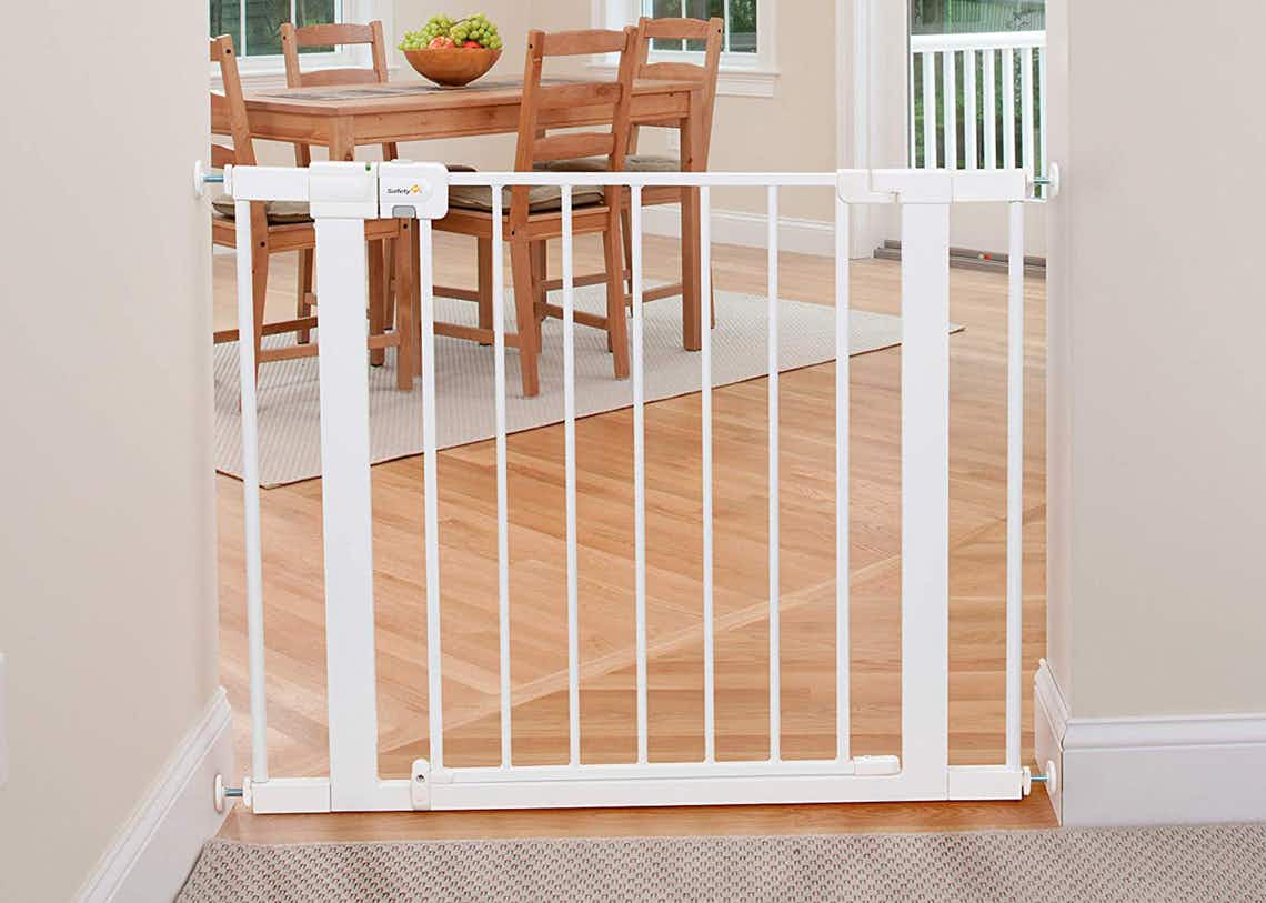stock photo of safety first baby gate staged in door way