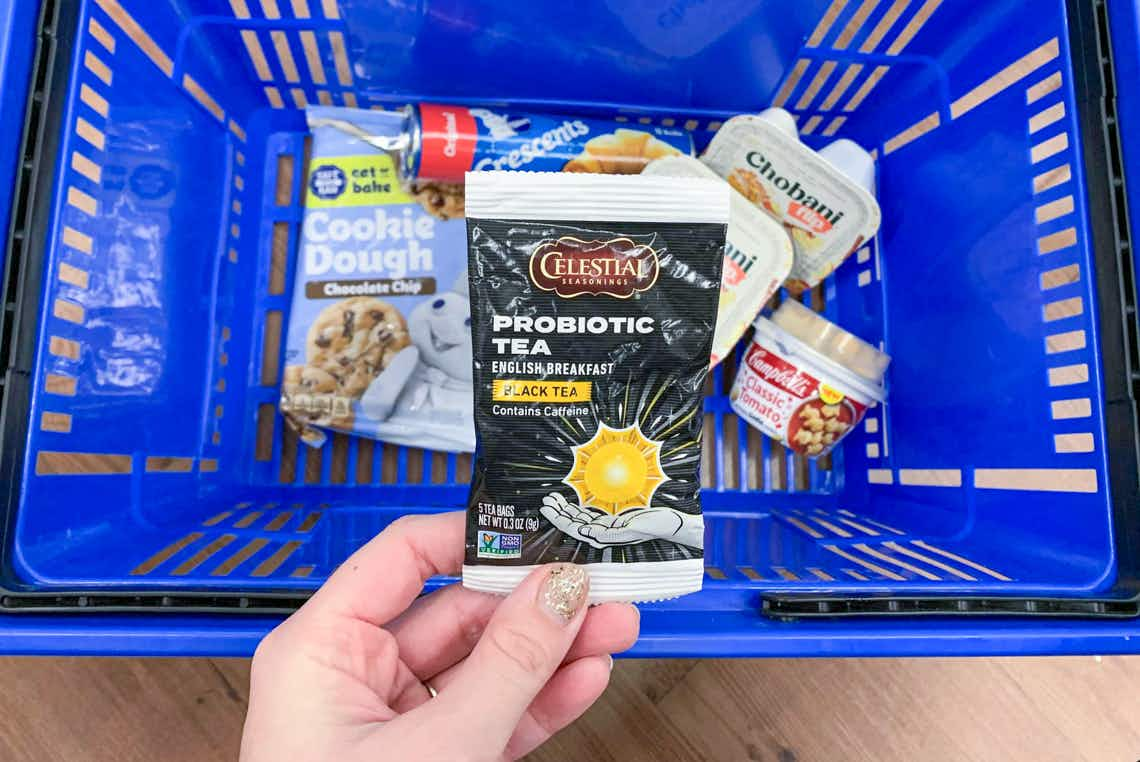 celestial seasonings tea held up above pillsbury chobani and campbell's in walmart basket