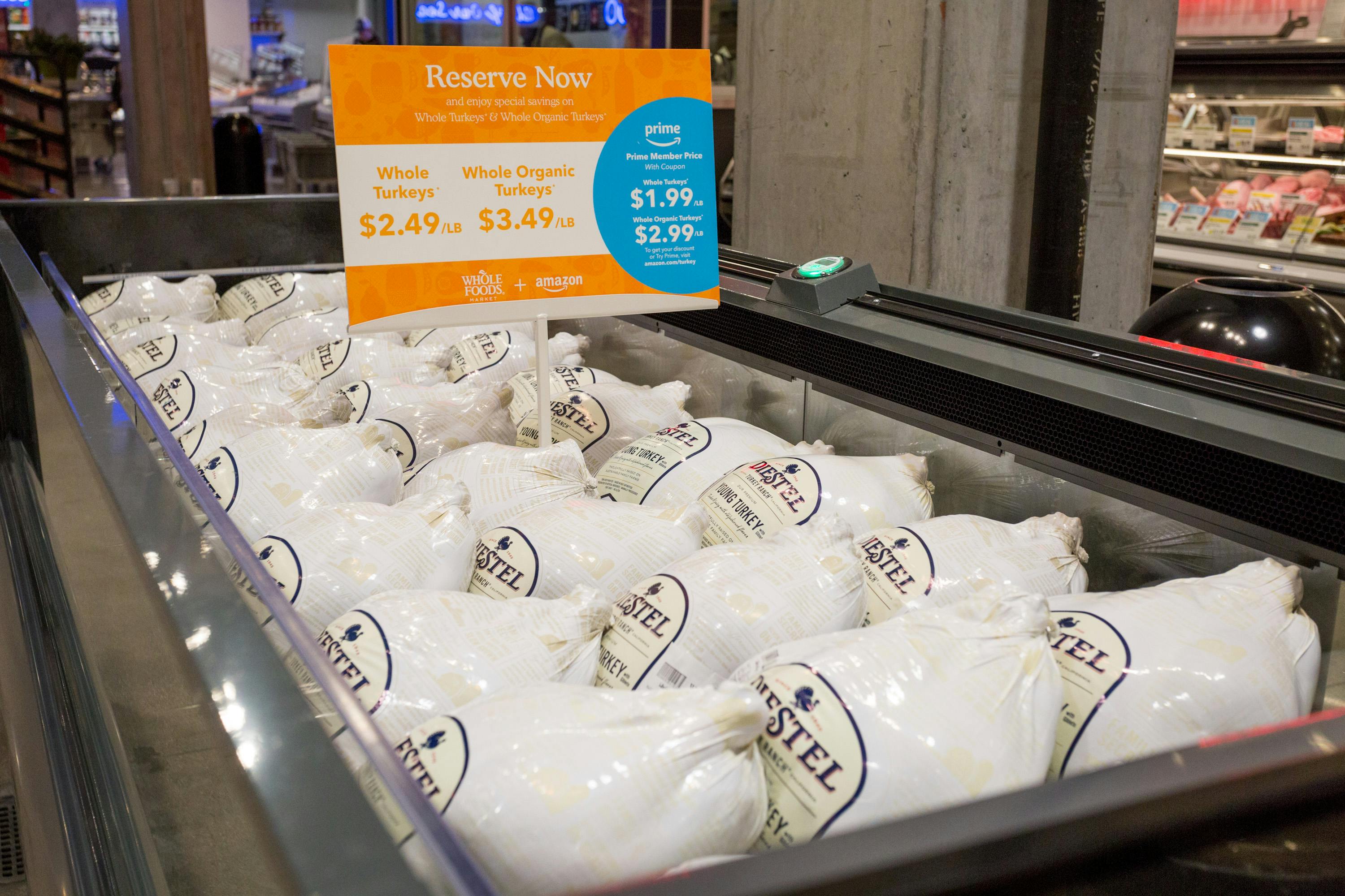 A freezer filled with frozen Turkeys at Whole Foods.