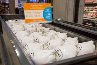 A freezer filled with frozen Turkeys at Whole Foods.