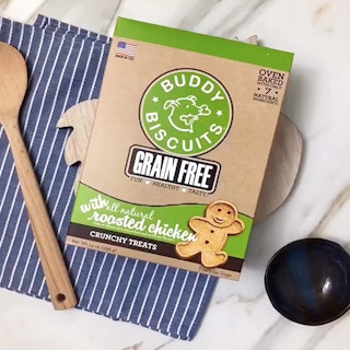 A box of dog biscuits on a table.