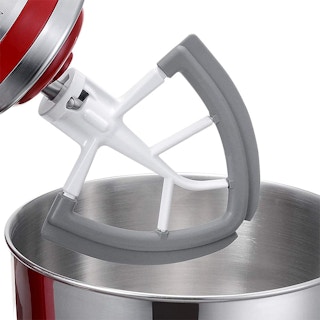 A dual-sided silicone mixer paddle.
