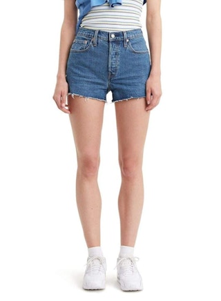 A woman wearing Levi's 501 original shorts.
