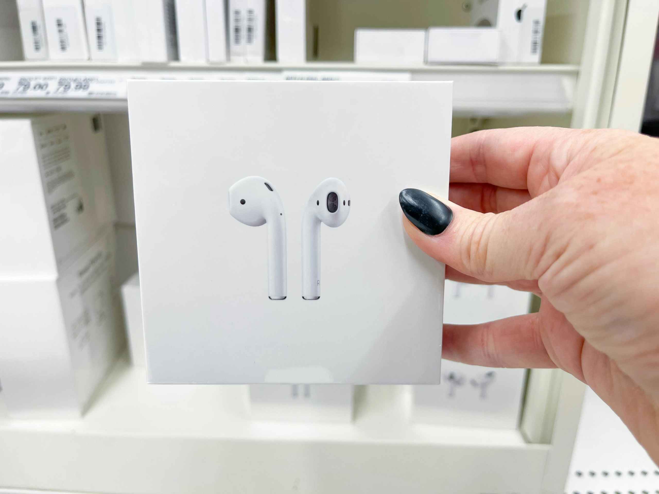 airpods being held