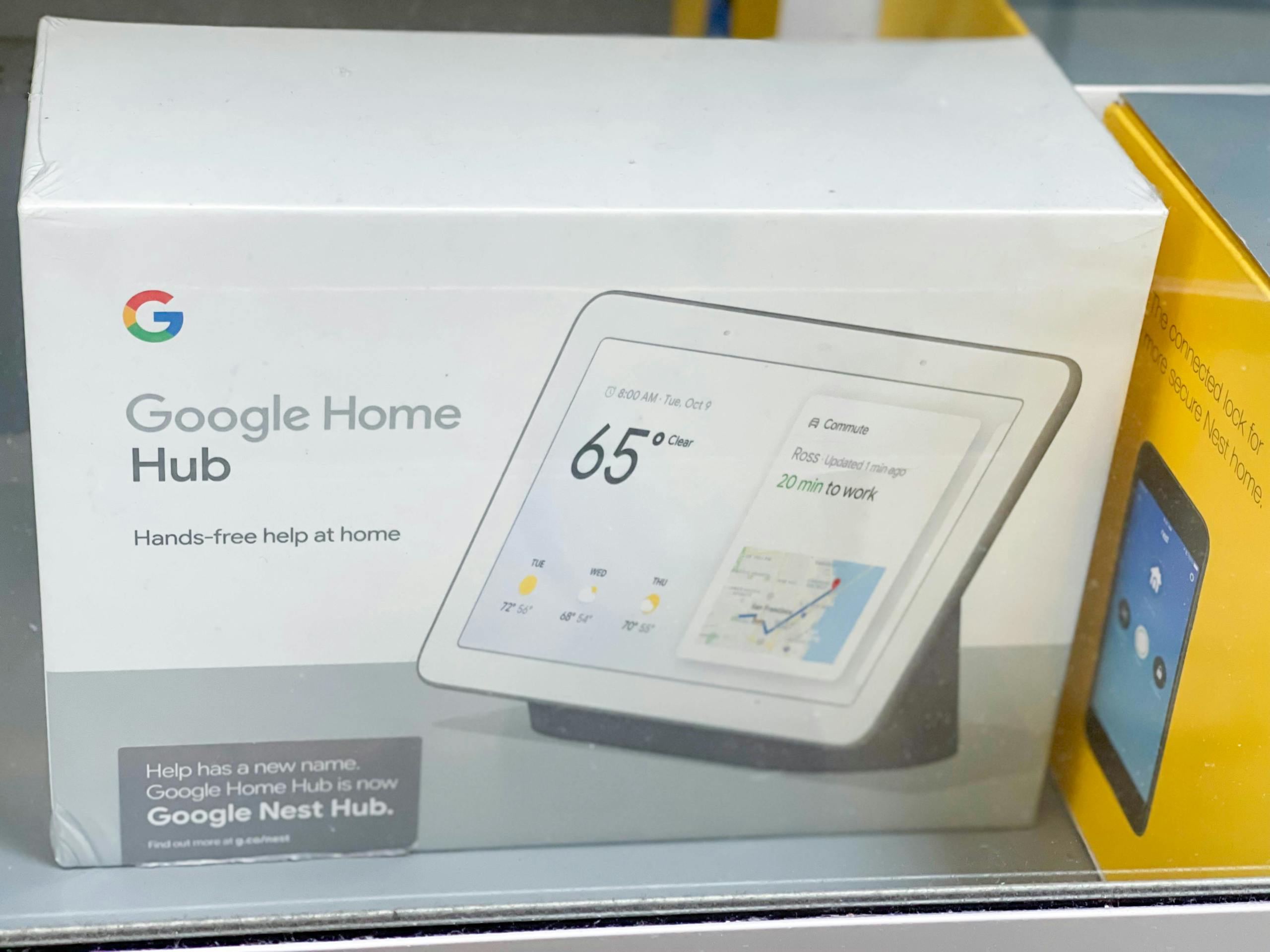 google home hub in box on shelf